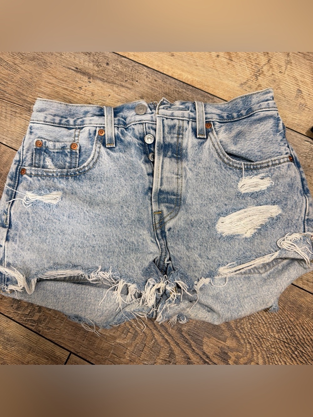 High-Rise Light Blue Distressed Denim Shorts